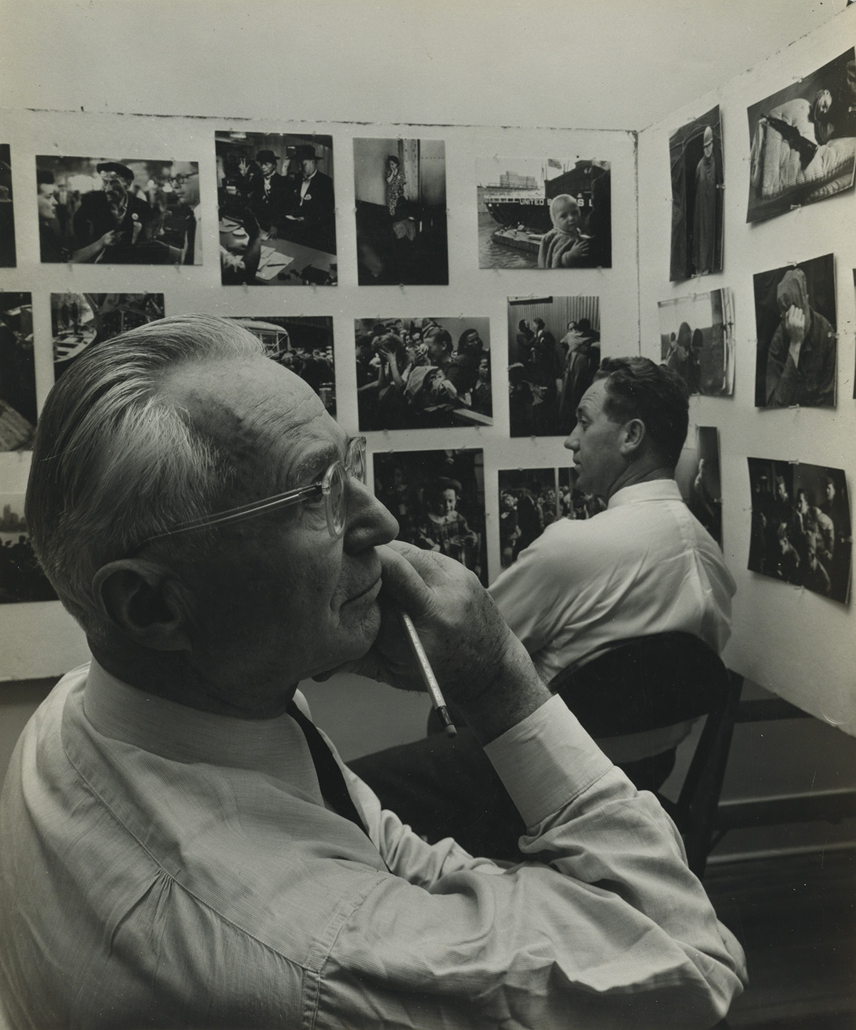 ARNOLD NEWMAN (1918-2006) Edward Steichen making selections for the The Family of Man publication at the Museum of Modern Art, New York
